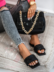 Black flat slippers