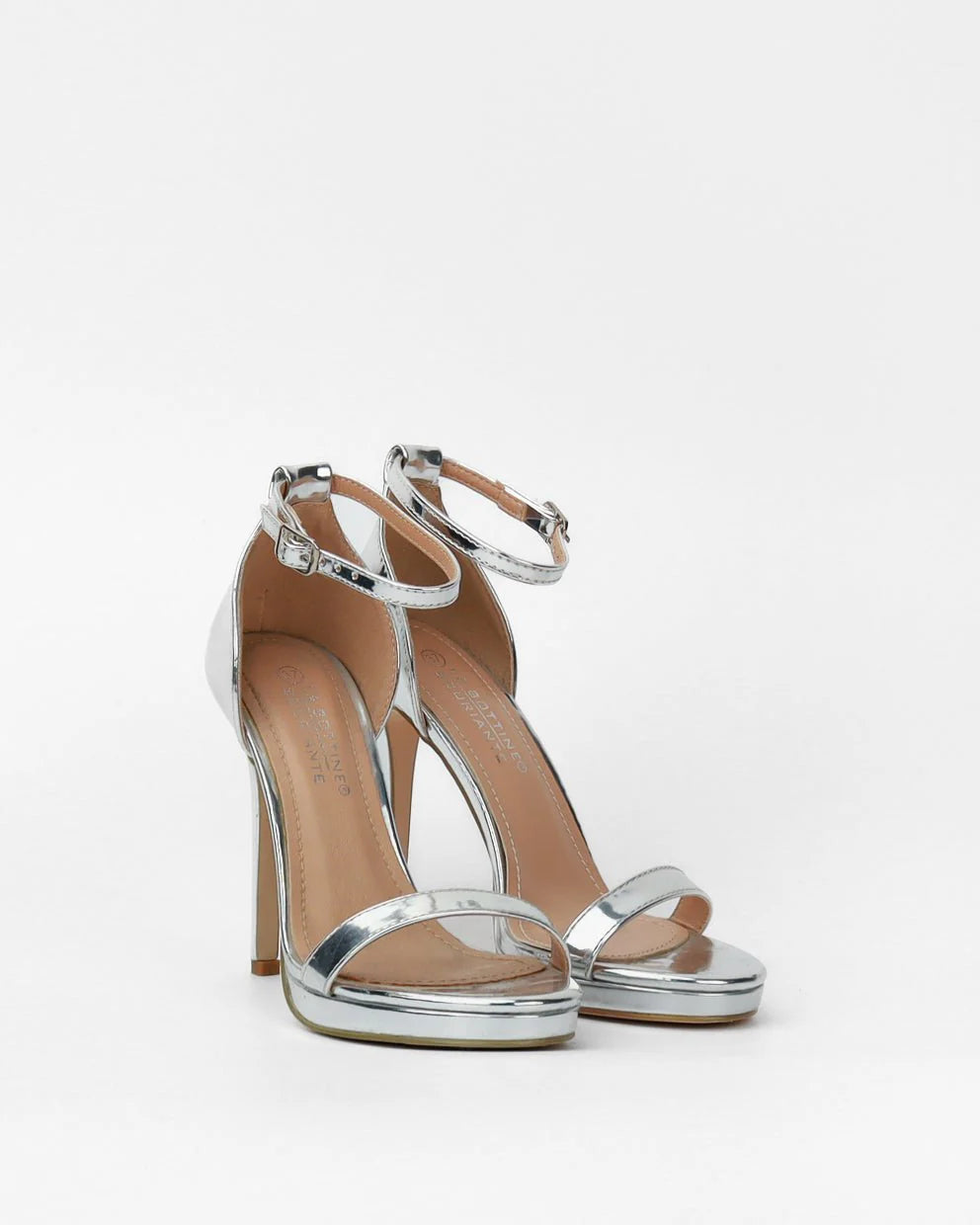 Silver sandals on a thin heel