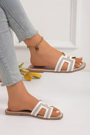 White flat slippers