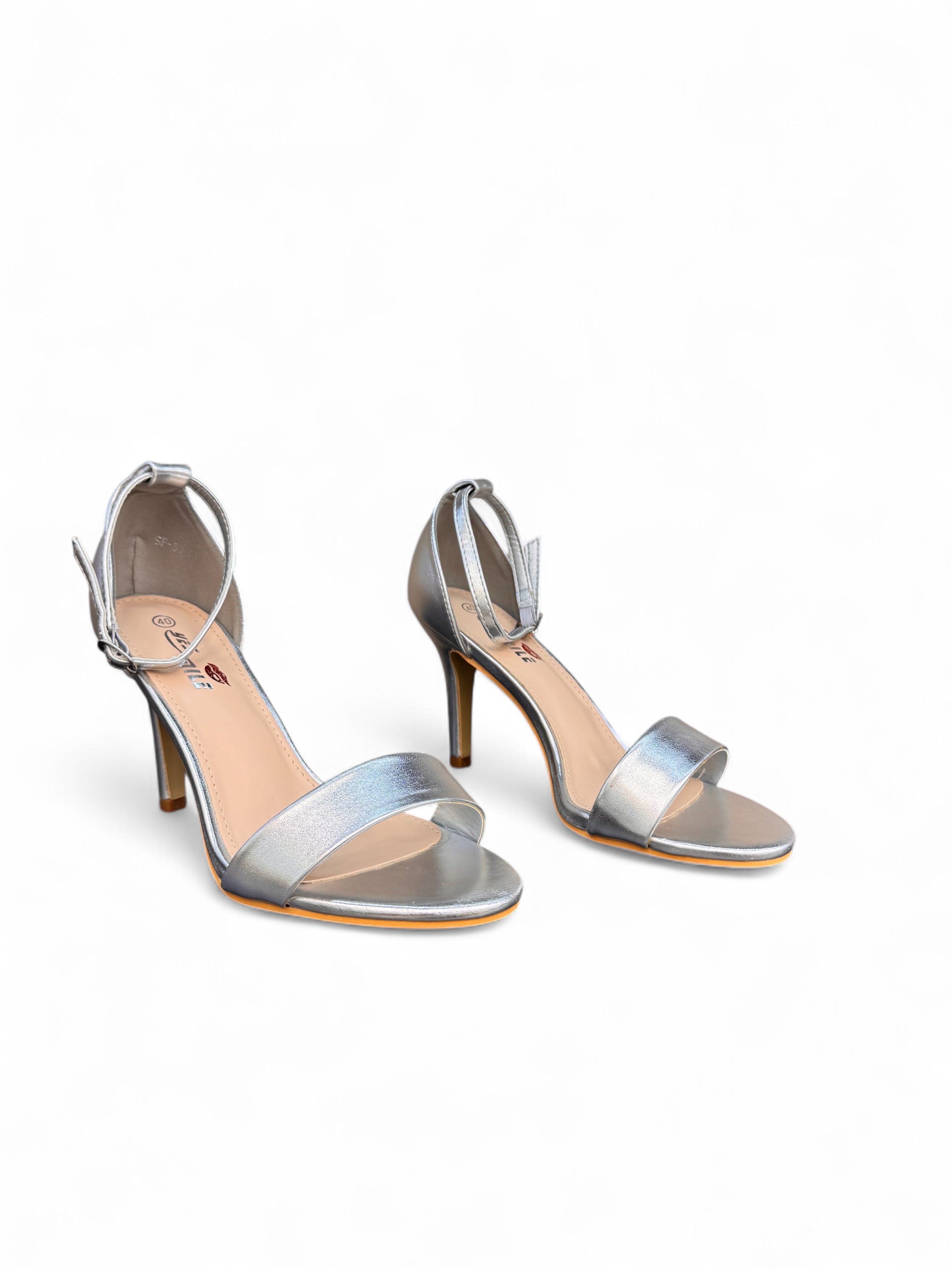 White sandals with a thin heel