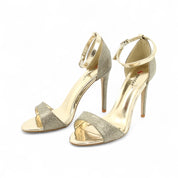 Gold sandals on a thin heel