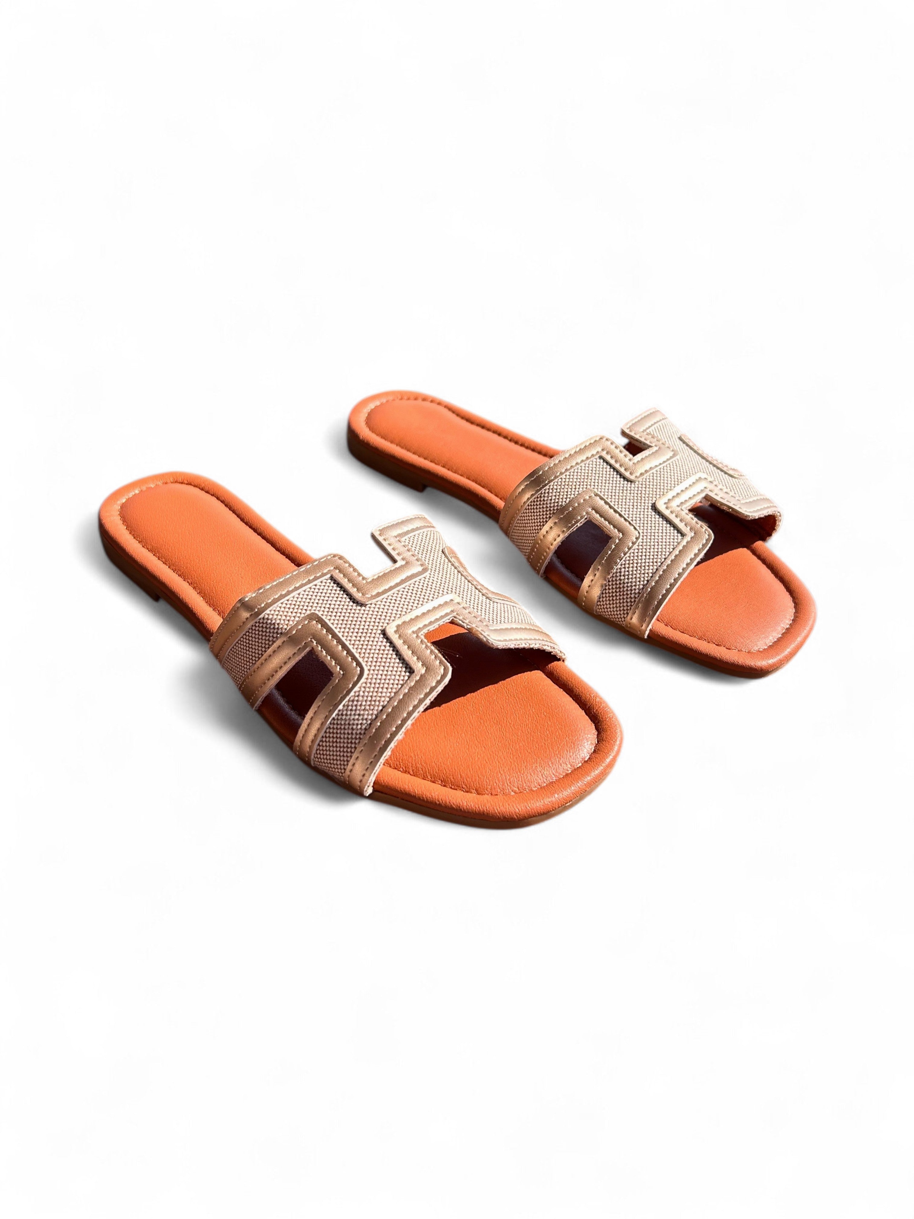 Black flat slippers